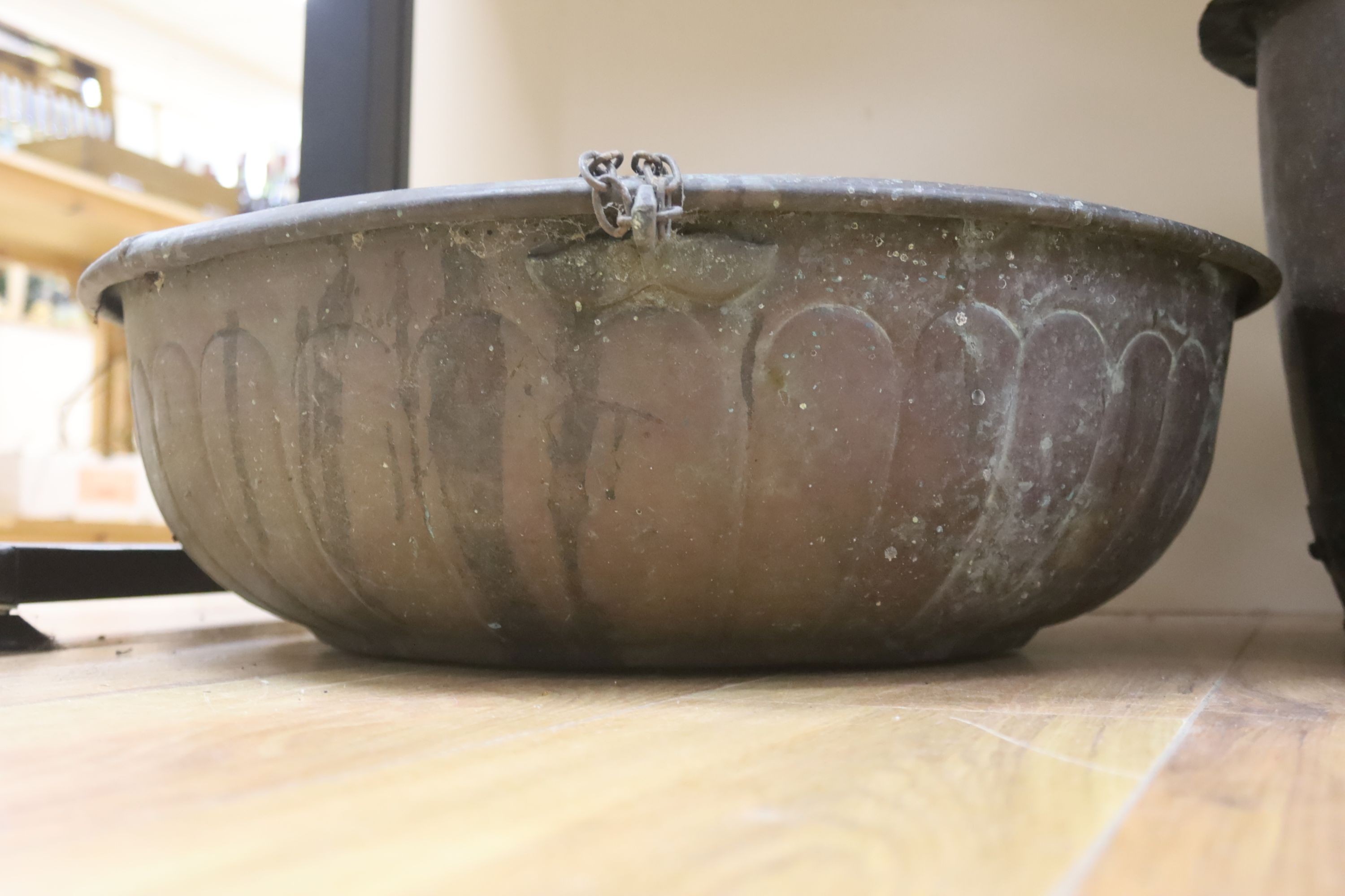 Two large copper bowls and related items, largest 54 cms diameter.
